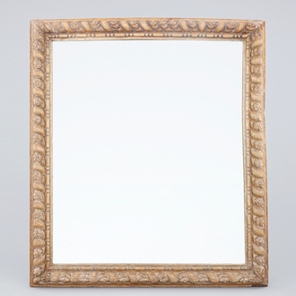 A mirror in carved wood frame, 18/19th C.